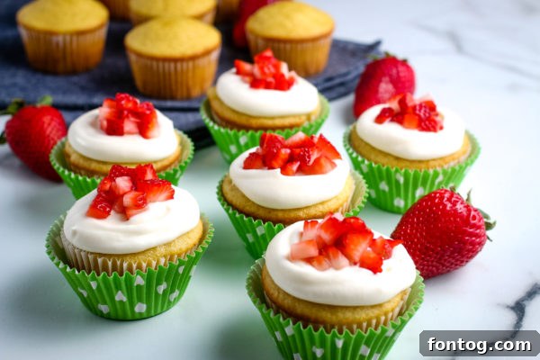 Closeup of frosted Gluten-Free Strawberry Shortcake Cupcakes