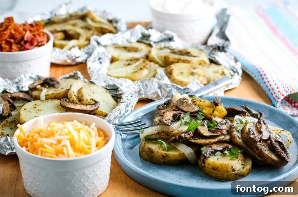 Individual grilled potato foil packets ready for the grill