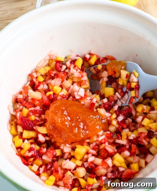 Easy Fruit Salsa in a bowl with a serving spoon