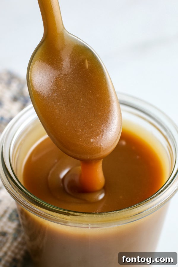 Velvety Gluten-Free Caramel Sauce 4 Classic Caramel Sauce (Gluten-Free) poured over fresh apple slices