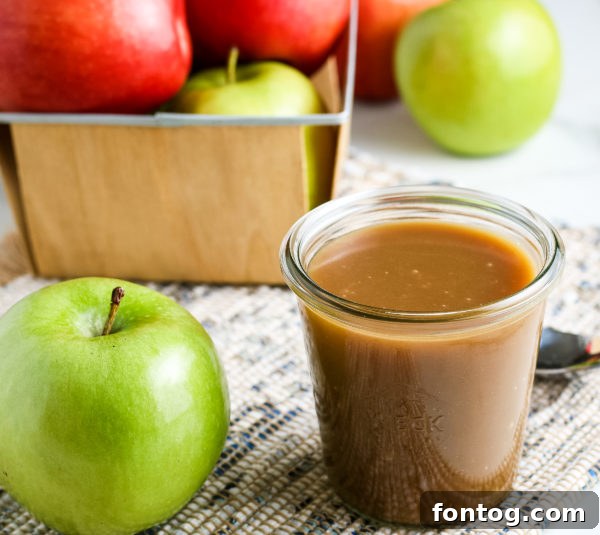 Velvety Gluten-Free Caramel Sauce 7 Classic Caramel Sauce (Gluten-Free) in a glass jar with a spoon
