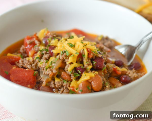 A rich, hearty chili simmering in a multi-cooker, perfect for a cozy meal.
