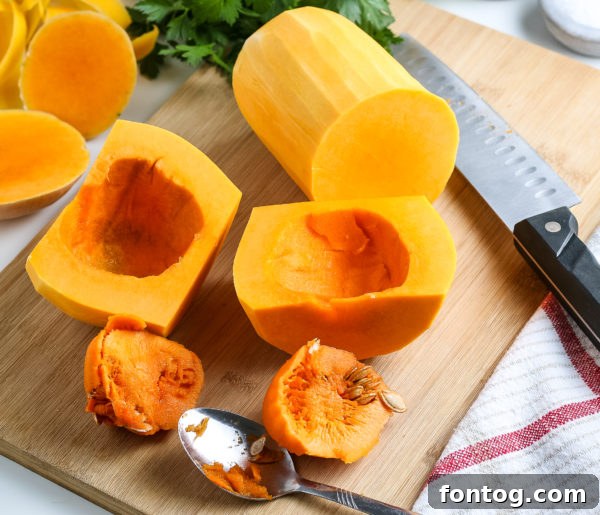 Butternut squash being peeled on a cutting board.
