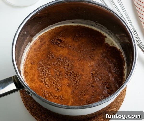 Crafting Your Perfect Pumpkin Spice Latte 5 A finished homemade pumpkin spice latte garnished with whipped cream and cinnamon