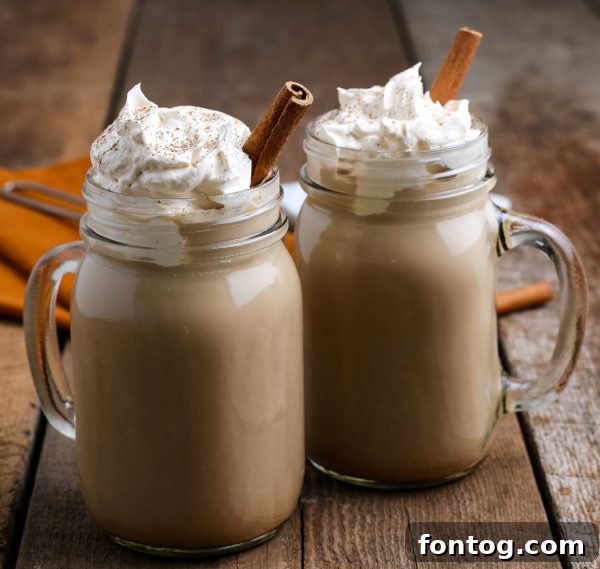 Crafting Your Perfect Pumpkin Spice Latte 7 A delicious homemade pumpkin spice latte in a glass mug on a white background