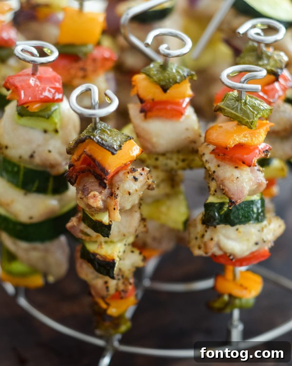 Ninja Foodi Chicken Kabobs (Air Fryer) - A vibrant plate of chicken and vegetable skewers.
