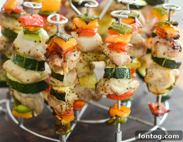 Ingredients for Ninja Foodi Chicken Kabobs including chicken, bell peppers, and red onion.