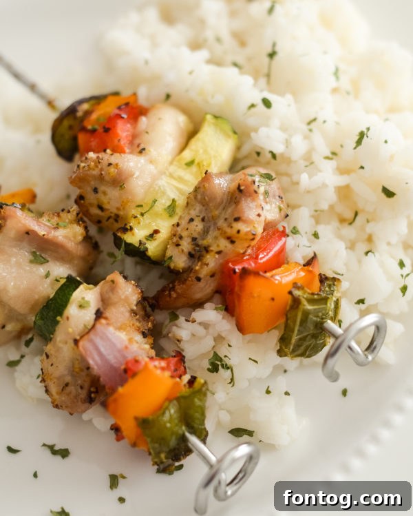 Ninja Foodi Skewer Stand loaded with chicken and vegetable kabobs.