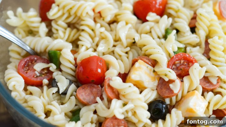 Refreshingly easy and quick Ninja Foodi Cold Pasta Salad, vibrant with fresh vegetables, and customizable to be gluten-free.