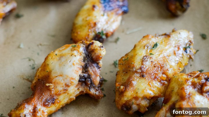 Perfectly saucy and crispy Easy Grilled Chicken Wings, offering a delightful crunch and robust flavor for any gathering or casual meal.