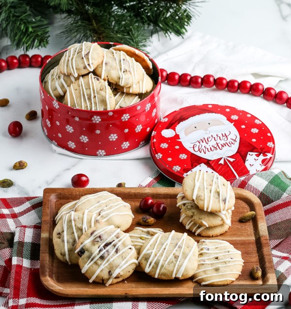A batch of Cranberry Pistachio Cookies on a cooling rack