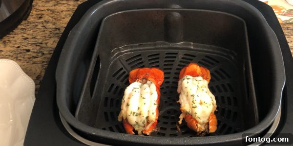 Butterflied lobster tail with meat pulled up and shell prepared for grilling.