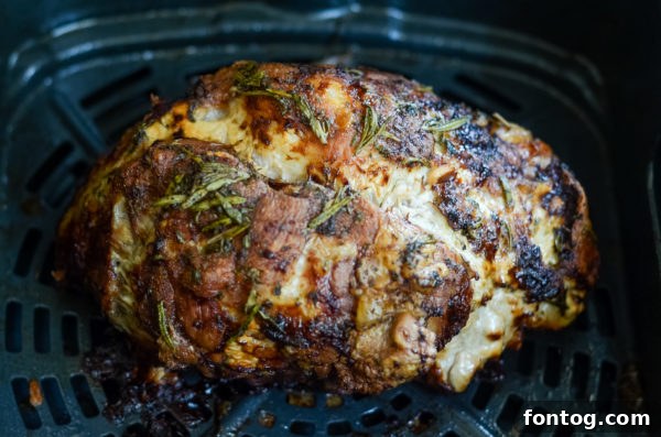 Air Fried Turkey with Rosemary and Garlic, served on a platter.