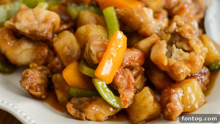 Easy and flavorful Ninja Foodi Hawaiian Chicken, coated over air-fried chicken for a delicious gluten-free meal.