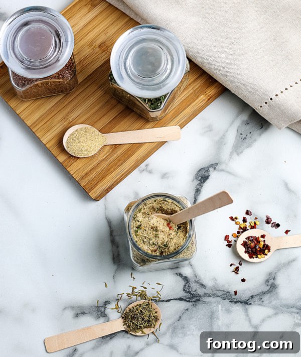 A jar of homemade all-purpose seasoning with a measuring spoon