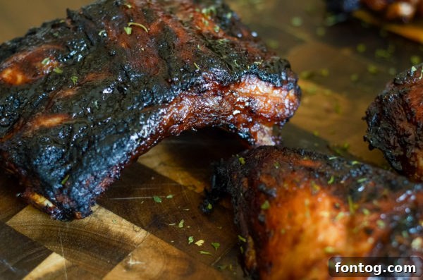Seasoned baby back ribs resting before grilling in Ninja Foodi