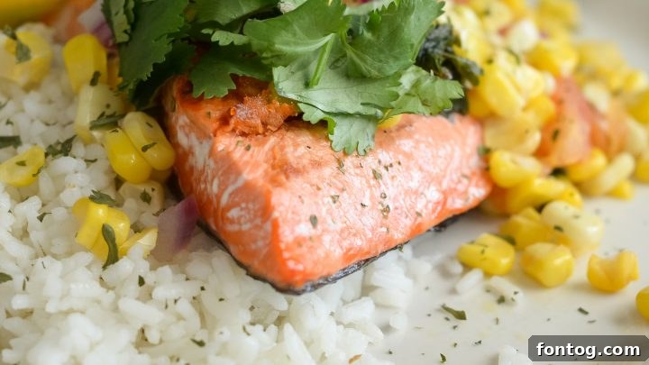 Perfectly grilled salmon fillets topped with vibrant roasted corn salsa.