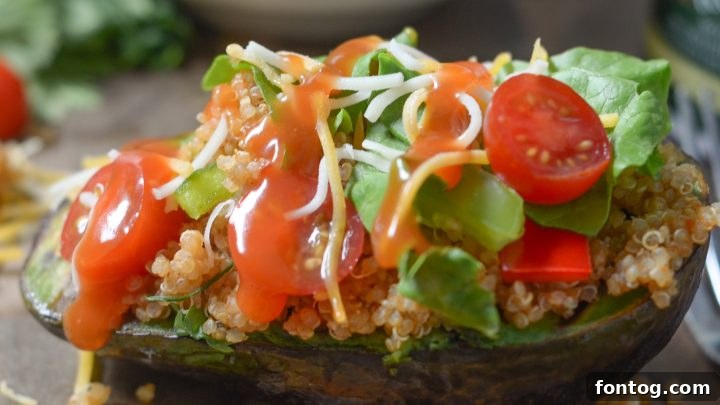 Taco Style Quinoa Stuffed Avocado, a fresh and vibrant vegetarian dish.