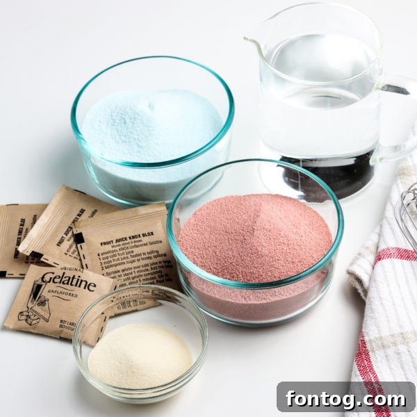 Ingredients for Jello Jigglers laid out, including flavored Jello boxes and unflavored gelatin sachets.