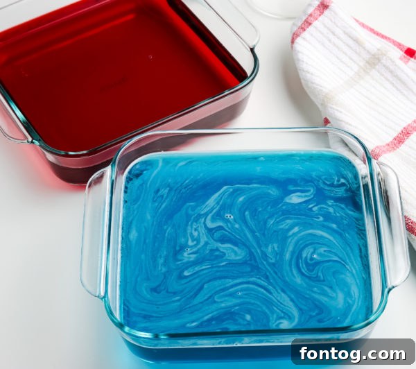 A pan filled with liquid Jello mixture, ready to be refrigerated to set into firm Jigglers.