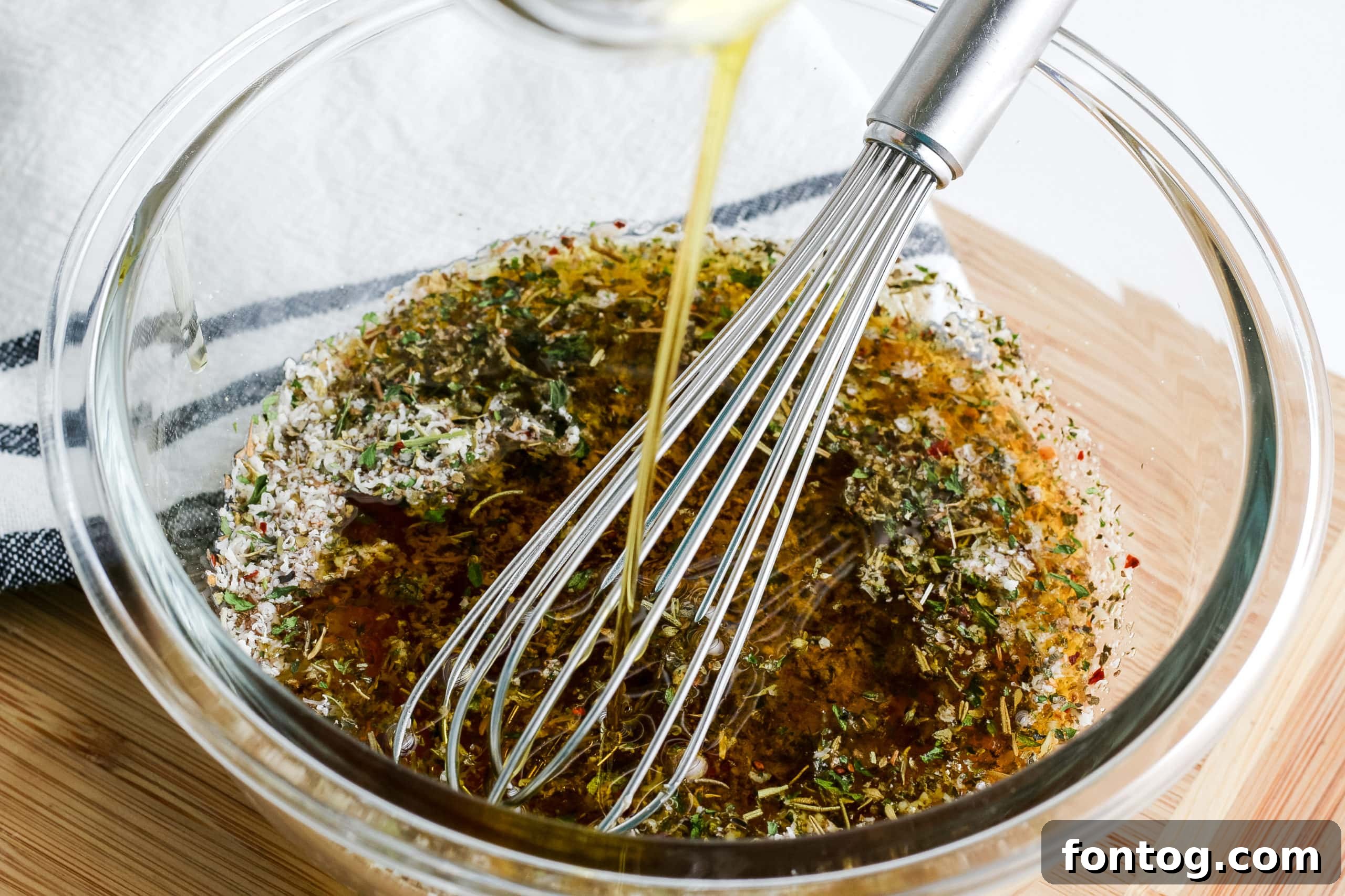 Craft Your Signature Italian Dressing 4 Homemade Italian Dressing in a glass jar with a whisk
