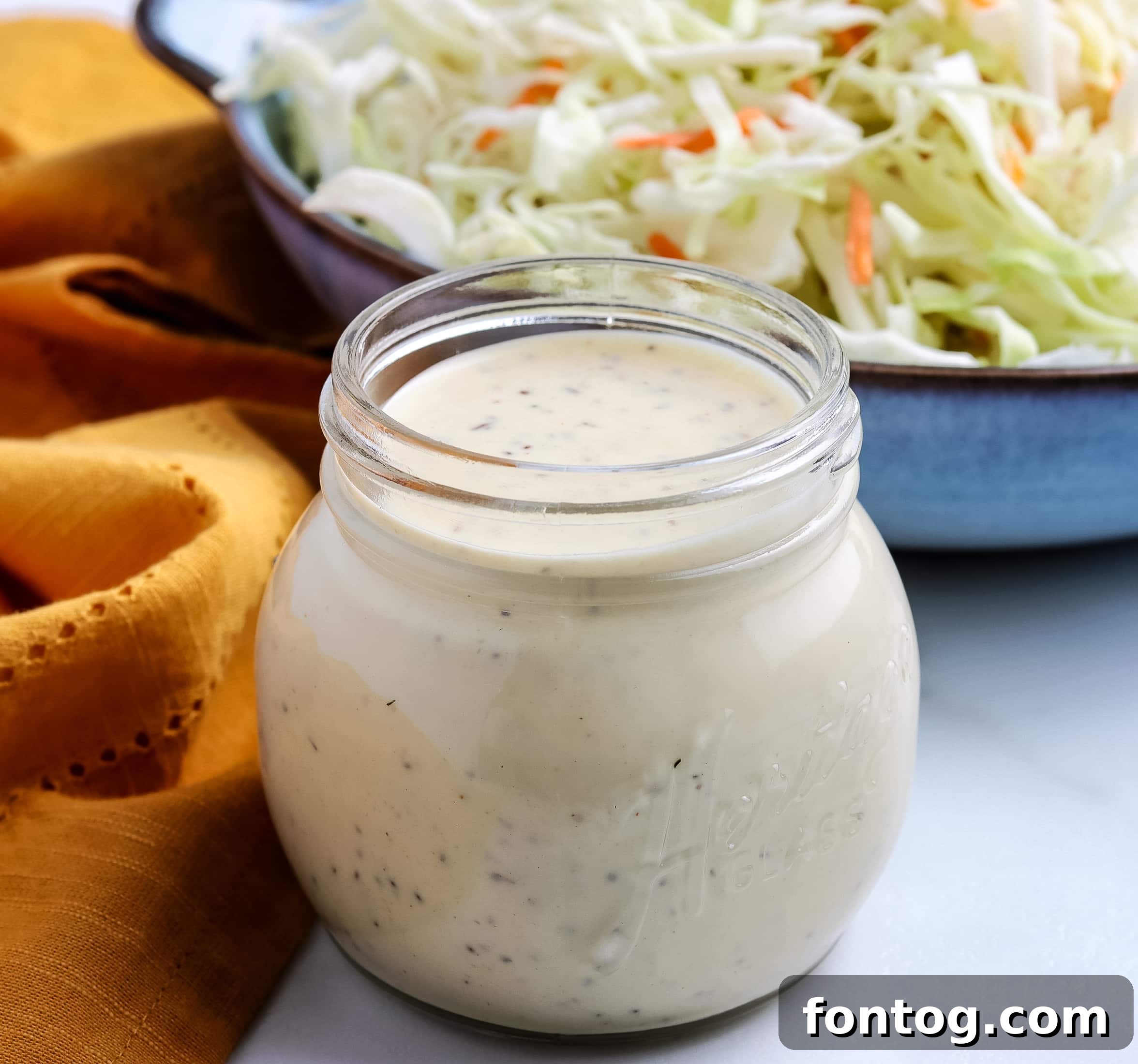 How to Make Coleslaw Dressing - A variety of BBQ foods with coleslaw