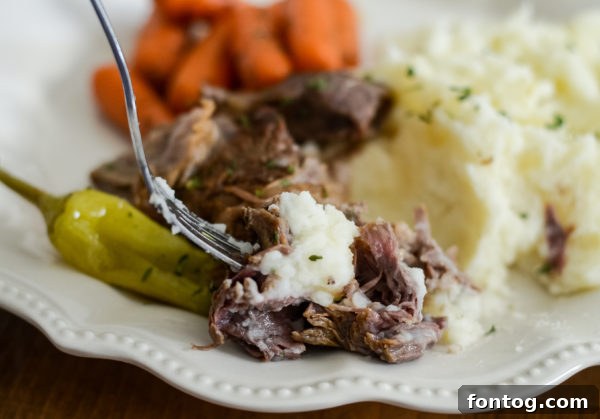 Shredded Slow Cooker Mississippi Pot Roast ready to be served