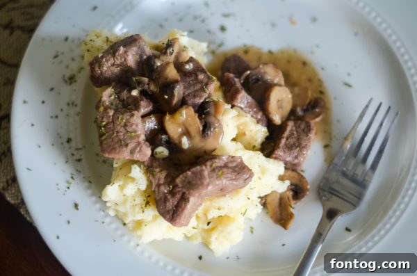 Ninja Foodi pot with beef tips and gravy thickening with cornstarch