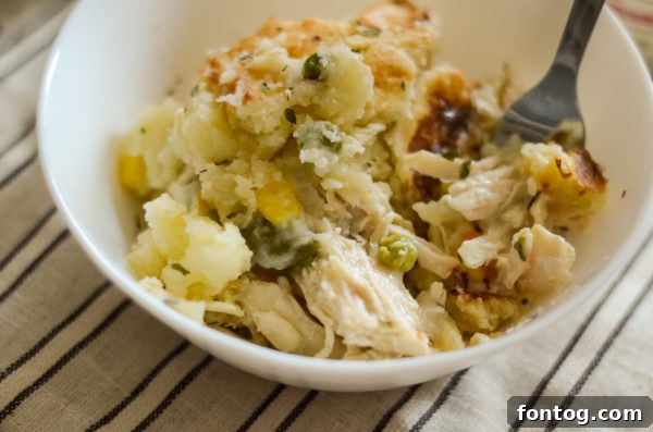 The golden and crispy top of a gluten-free Ninja Foodi chicken pot pie