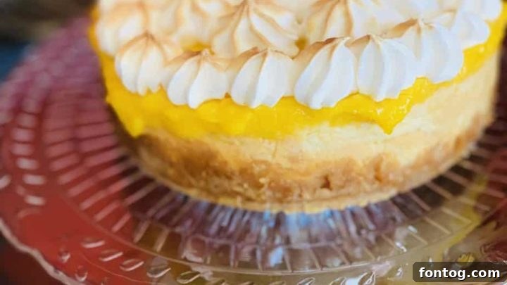 A stunning Lemon Meringue Cheesecake, baked in a Ninja Foodi with a torched meringue topping.