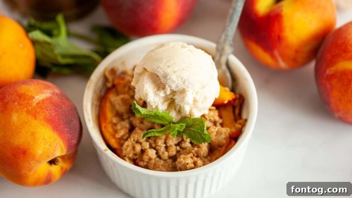 Warm Air Fryer Peach Cobbler, bubbling with sweet peaches.