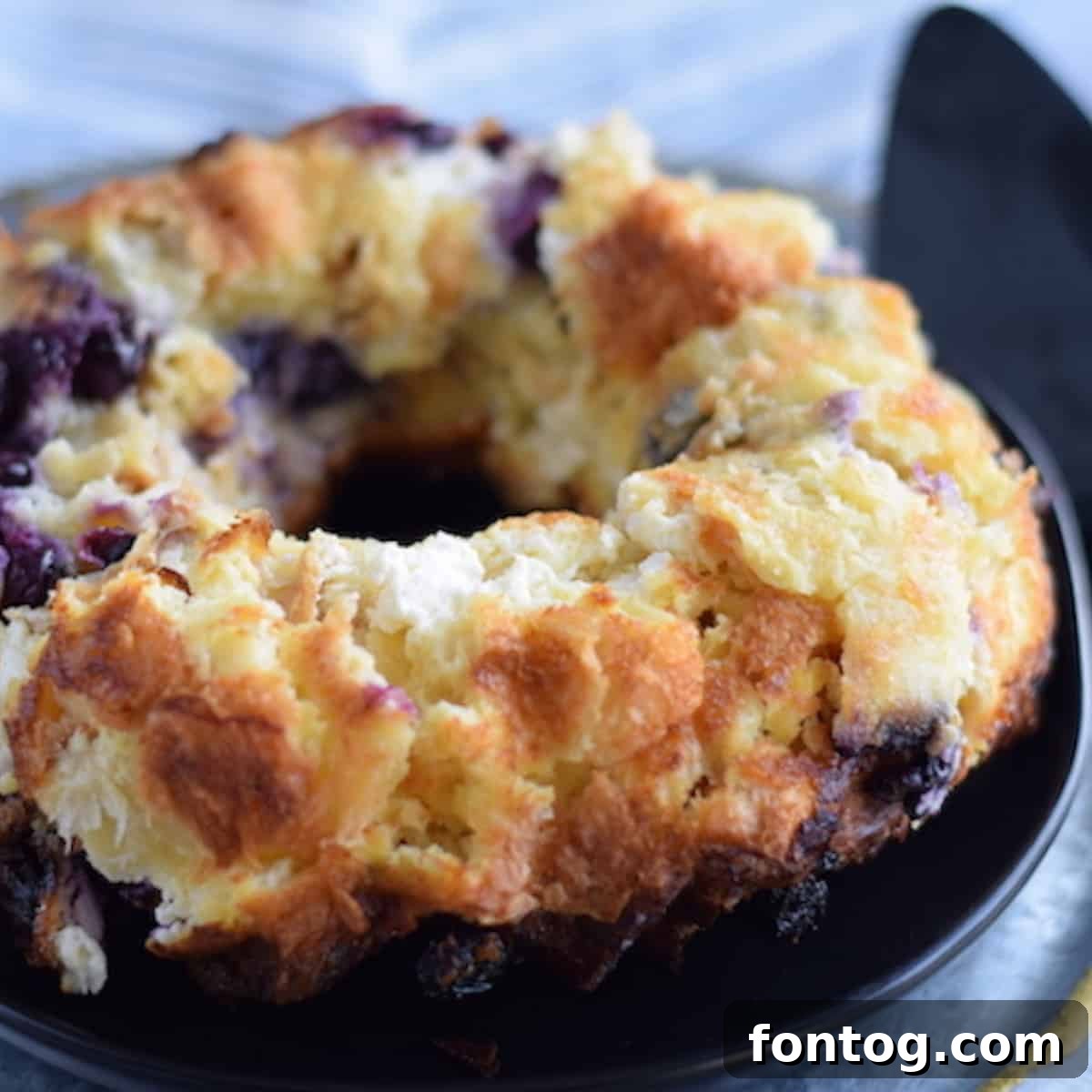 Rich Ninja Foodi Bread Pudding with Blueberries and Cream Cheese.