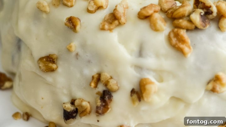 A slice of Ninja Foodi Carrot Cake, moist and flavorful.