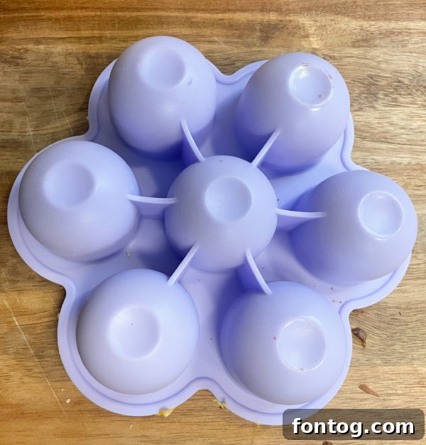 Delicious Ninja Foodi Air Fryer Egg Bites 6 Ninja Foodi Egg Bites cooling in the silicone mold inside the air fryer basket