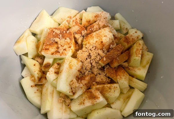 Close-up of peeled and sliced green apples ready for the Ninja Foodi pot.