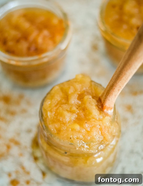 Variety of apples displayed, including Granny Smith and Golden Delicious, ideal for blending in applesauce.