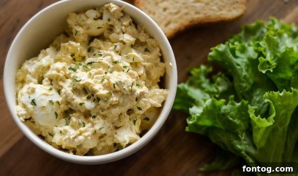 Ingredients for Ninja Foodi egg salad being mixed in a bowl