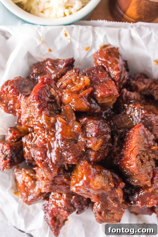 pellet grill bbq burnt ends - close up of tender, saucy meat cubes