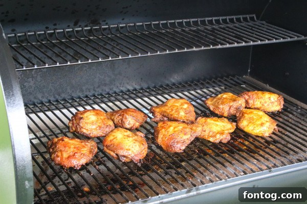 Pellet grill showing wood pellets, suitable for smoking chicken.
