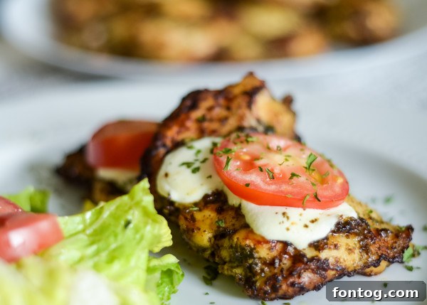 Cooked Ninja Foodi Chicken Pesto with melted mozzarella and herbs