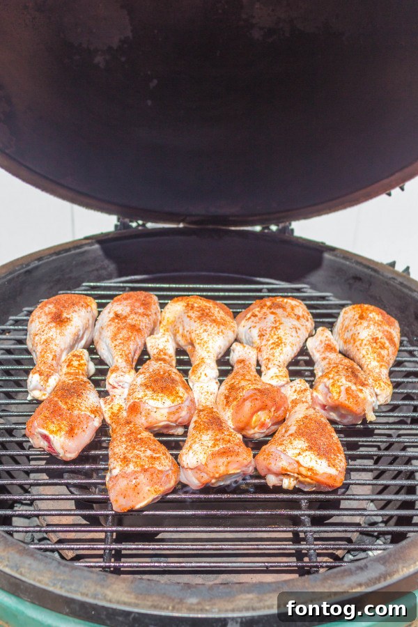 Juicy Pellet Smoked Chicken Drumsticks 3 close-up of smoked chicken drumsticks on the grill grates