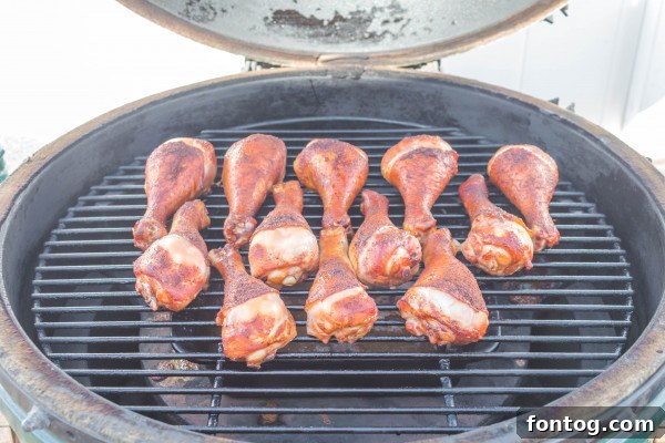 Juicy Pellet Smoked Chicken Drumsticks 4 meat thermometer inserted into a smoked chicken drumstick