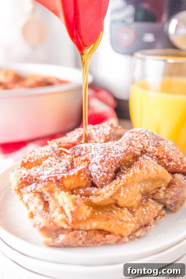 Ultimate Ninja Foodi French Toast Bake 7 Ninja Foodi French Toast Casserole topped with powdered sugar and syrup