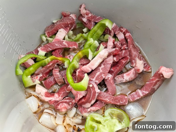 Ninja Foodi Philly Cheesesteak Perfection 3 thinly sliced ribeye steak for cheesesteak