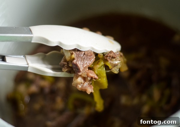 Ninja Foodi Philly Cheesesteak Perfection 4 preparing thinly sliced meat for Ninja Foodi cheesesteak