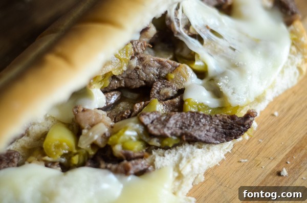 Ninja Foodi Philly Cheesesteak Perfection 6 Ninja Foodi cheesesteak sandwiches with melted cheese