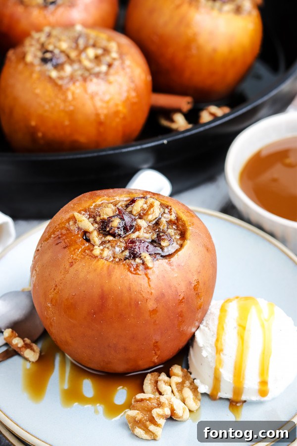 Smoked apples cooking in a cast iron skillet on a grill