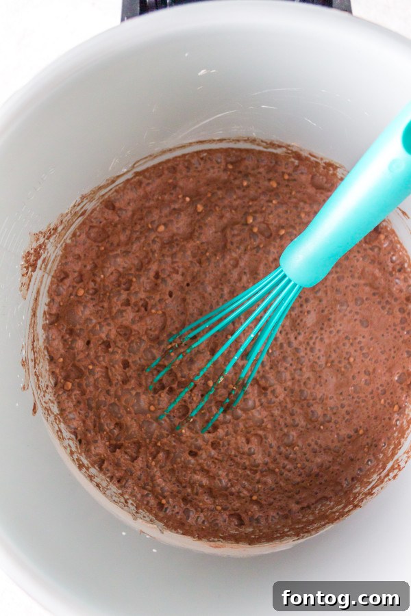 Three servings of Ninja Foodi chocolate pudding in glass bowls