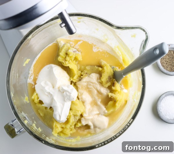 Ember Mashed Potatoes 4 Close-up of various types of wood pellets, suggesting different flavor choices for smoking.