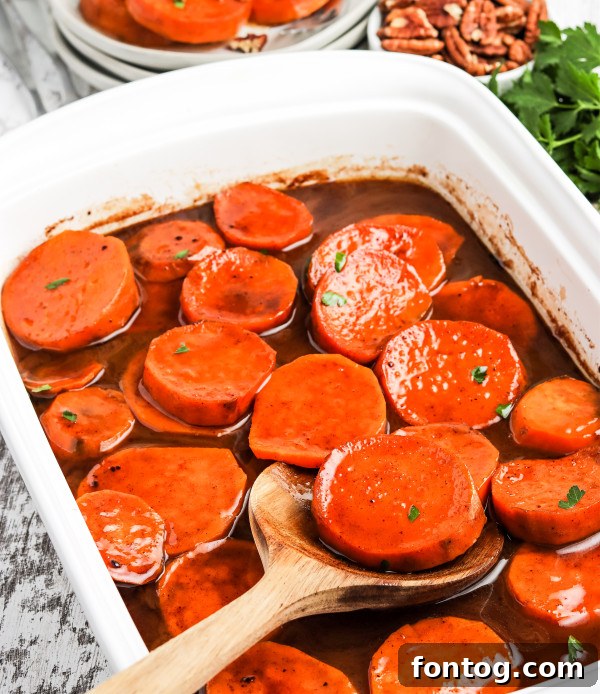 Deliciously baked candied yams in a casserole dish, ready to be served